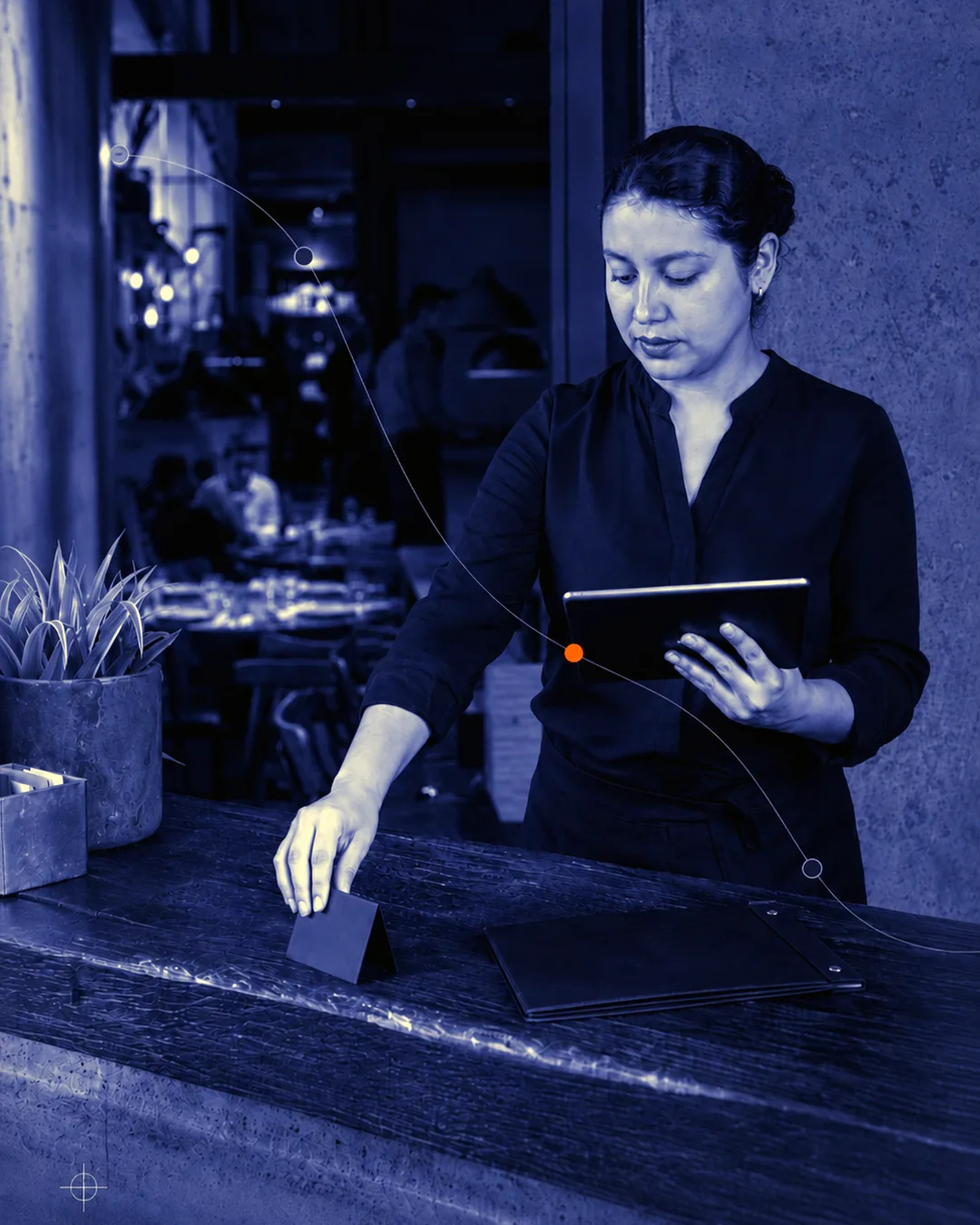 Bartender working in a dark ONYX hospitality scene